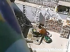 Desi girl bathes while singing, innocence interrupted by horny neighbor's peeping eyes.