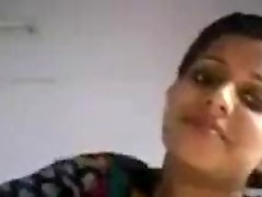 Attractive Kerala woman with large breasts reveals them on webcam.