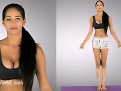 Desi beauty heats up yoga session with steamy moves and striptease.